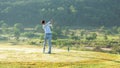 Golfer sport course golf ball fairway.ÃÂ  People lifestyle man playing game golf tee off on the green grass. Royalty Free Stock Photo